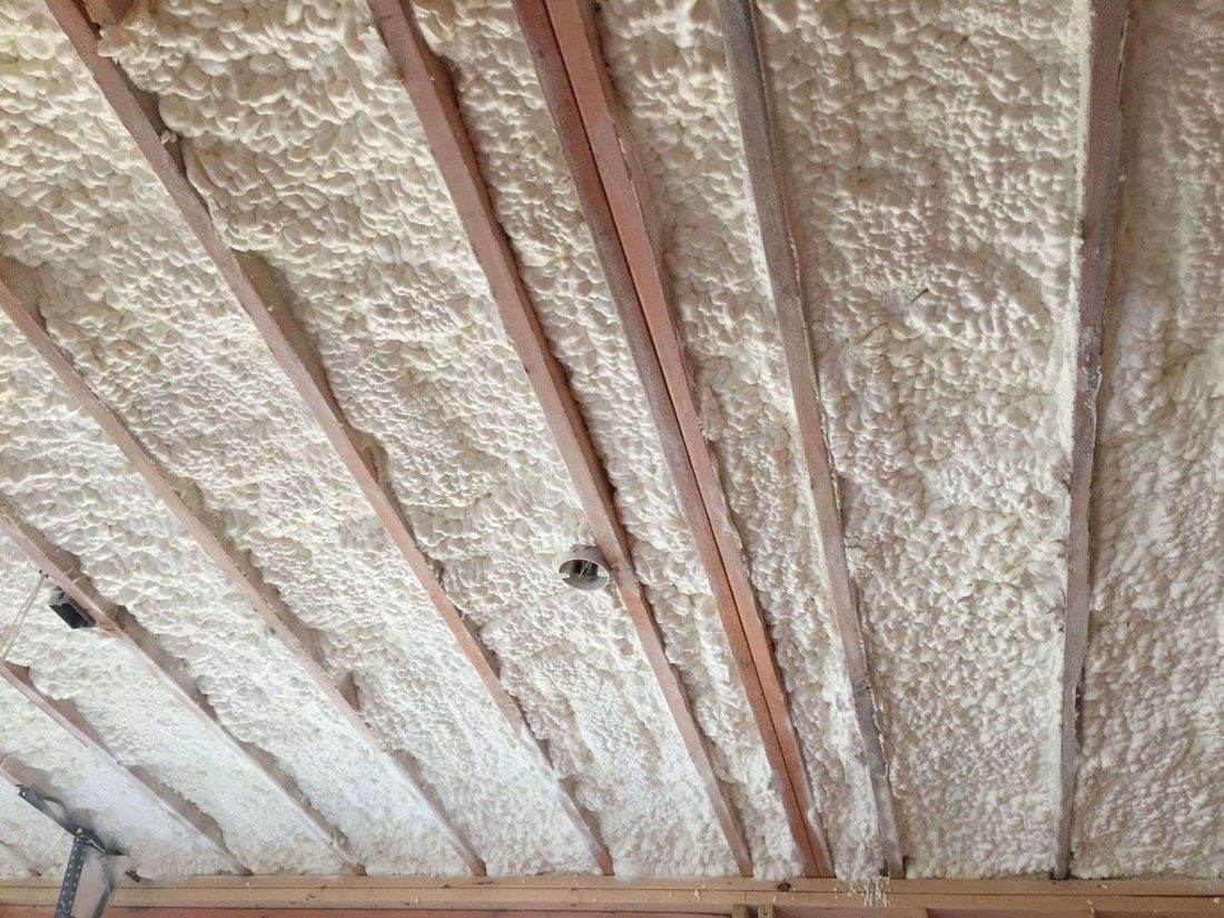 Finished spray foam insulation between attic rafters