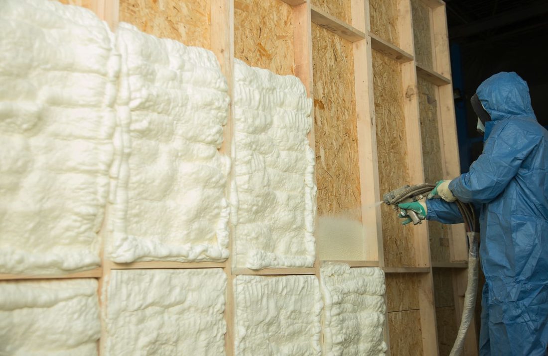Spray foam insulation applied to a stud wall